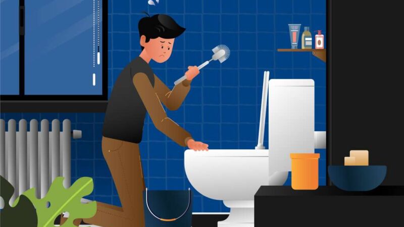 Bild zeigt Mann beim Toilette schrubben