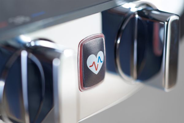 Das Bild zeigt einen Detailausschnitt des „Wellfit“-Buttons am „HansaEmotion“-Thermostat.